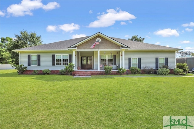 view of front of property featuring covered porch and a front yard