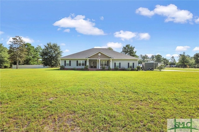 ranch-style home featuring a front lawn