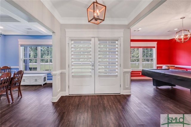 foyer featuring dark hardwood / wood-style flooring, coffered ceiling, and a healthy amount of sunlight