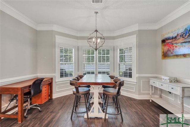 dining space with a notable chandelier, crown molding, and dark wood-type flooring