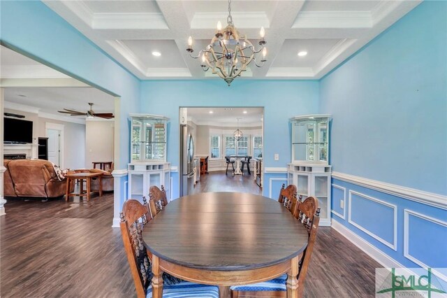 dining area with dark hardwood / wood-style floors, beamed ceiling, and coffered ceiling