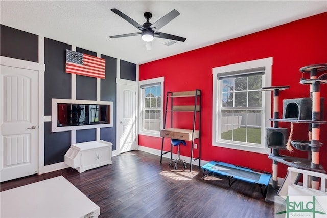 office with ceiling fan and hardwood / wood-style flooring