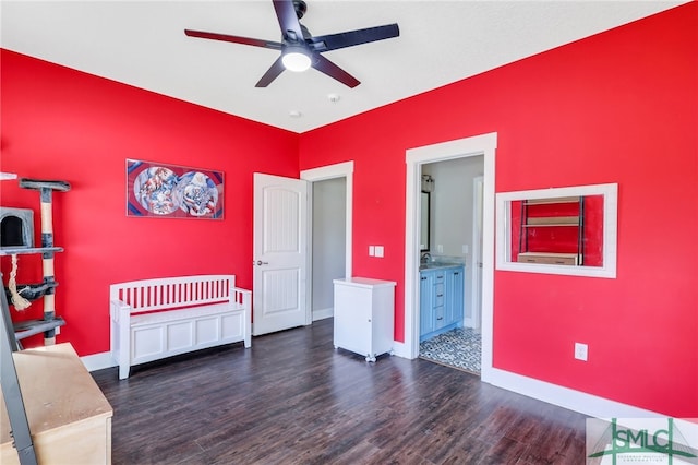 unfurnished bedroom with dark hardwood / wood-style floors, ensuite bathroom, and ceiling fan