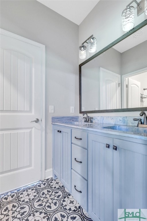 bathroom featuring dual vanity and tile patterned floors