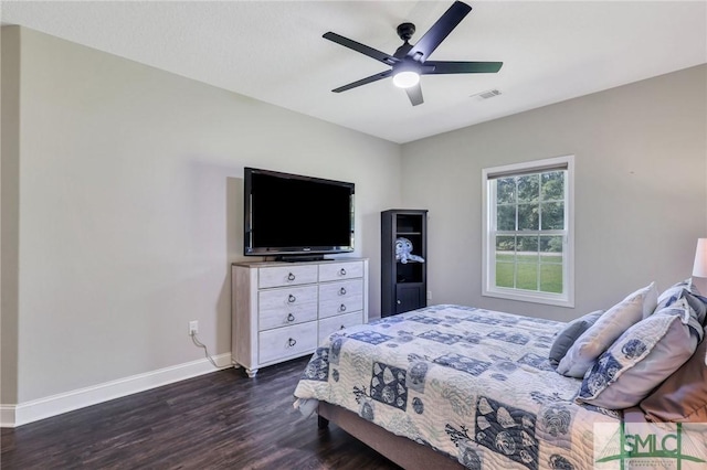 bedroom with dark wood-type flooring and ceiling fan