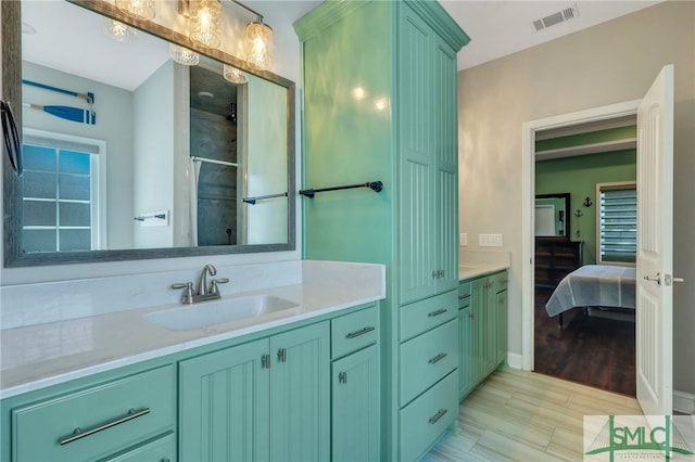 bathroom featuring vanity and wood-type flooring