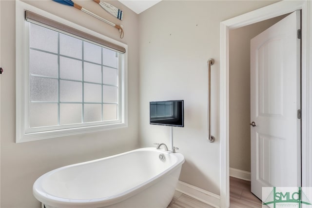 bathroom featuring a washtub