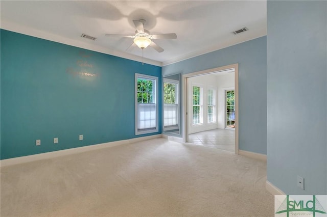 carpeted spare room with ceiling fan