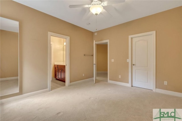 unfurnished bedroom featuring light colored carpet, connected bathroom, and ceiling fan