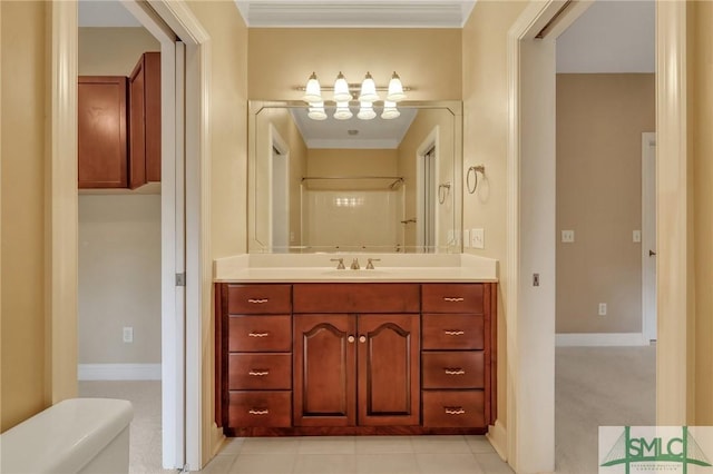 bathroom featuring a shower, toilet, vanity, and ornamental molding