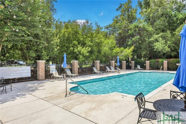 view of pool featuring a patio