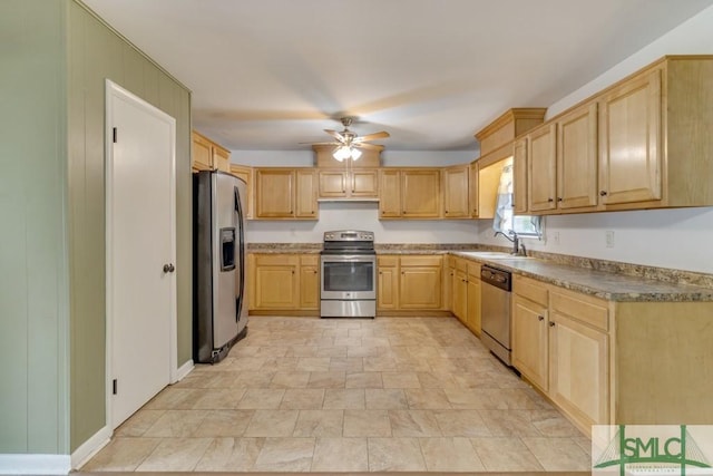 kitchen with sink, light brown cabinets, ceiling fan, and appliances with stainless steel finishes