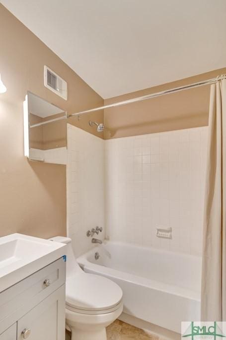 full bathroom featuring shower / tub combo, vanity, and toilet