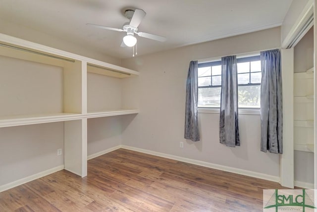 unfurnished room featuring ceiling fan and wood-type flooring