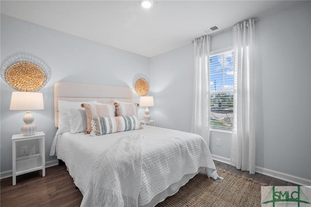 bedroom featuring dark hardwood / wood-style flooring