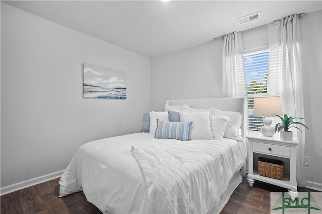 bedroom featuring dark hardwood / wood-style floors