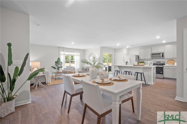 dining area with light wood-type flooring