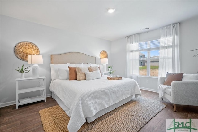 bedroom featuring dark hardwood / wood-style flooring