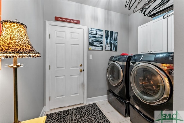 washroom with light tile patterned flooring, cabinets, and separate washer and dryer