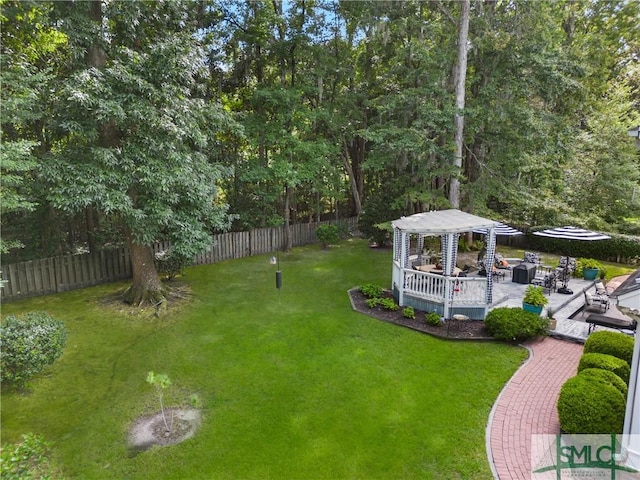 view of yard with a pergola and a gazebo