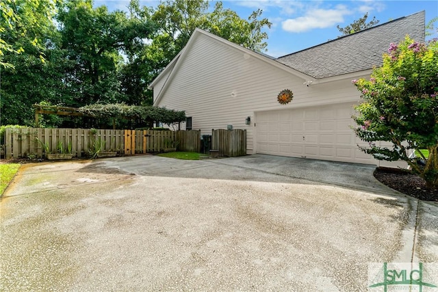 view of side of property with a garage