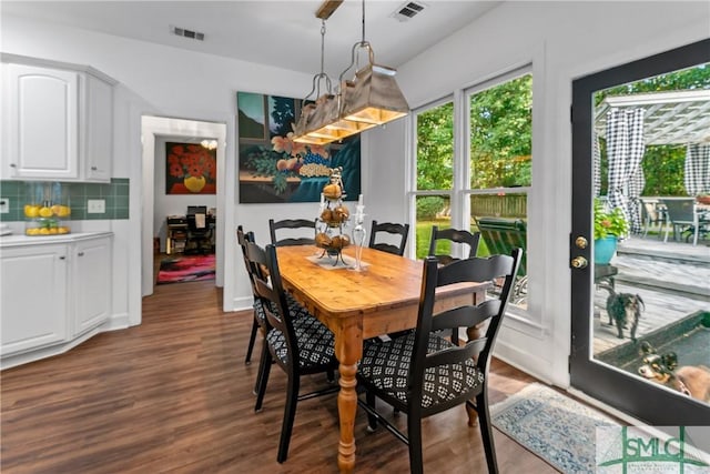 dining space featuring hardwood / wood-style flooring