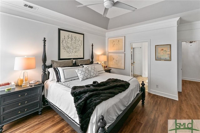 bedroom with crown molding, ceiling fan, and dark wood-type flooring