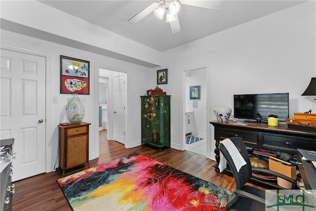 office space with dark wood-type flooring and ceiling fan