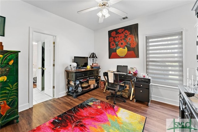 office featuring light hardwood / wood-style flooring and ceiling fan