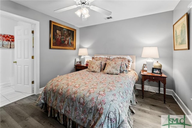 bedroom with hardwood / wood-style flooring and ceiling fan