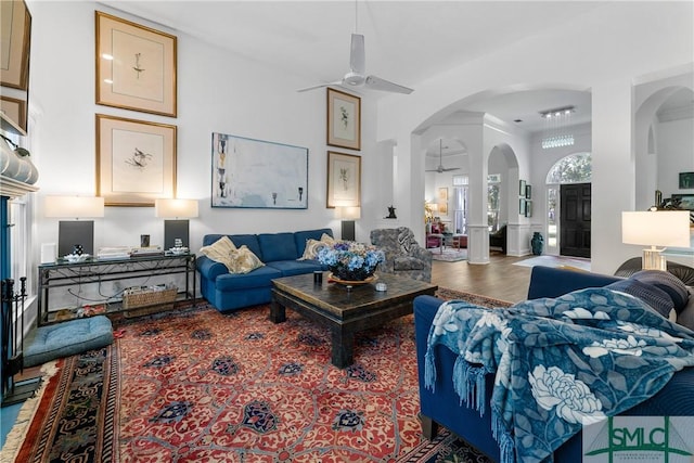 living room featuring hardwood / wood-style floors and ceiling fan