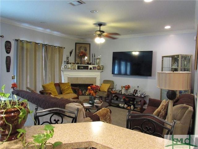 carpeted living room with crown molding and ceiling fan