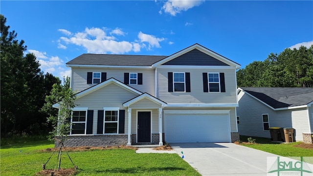 view of front of house featuring a garage and a front yard