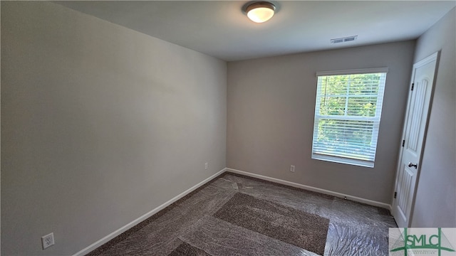 empty room featuring carpet flooring