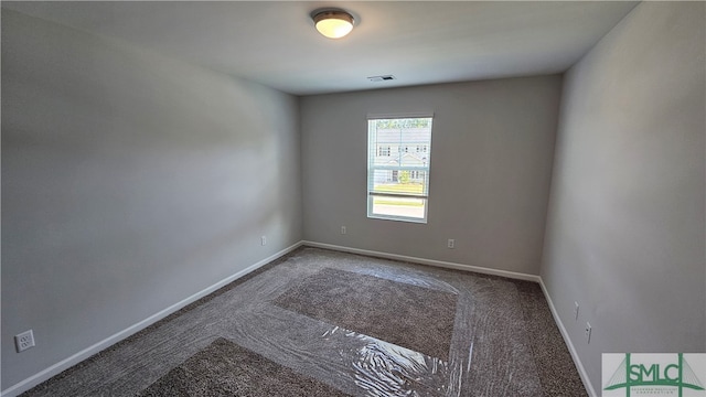 spare room featuring carpet flooring