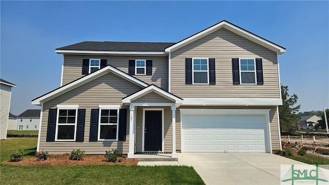 traditional-style home featuring driveway and an attached garage