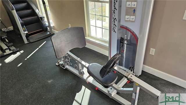 exercise room with baseboards