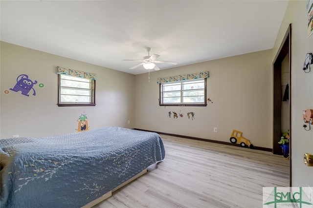 bedroom featuring light hardwood / wood-style flooring and ceiling fan