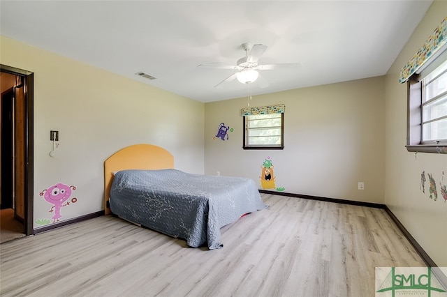 bedroom featuring ceiling fan and light hardwood / wood-style flooring