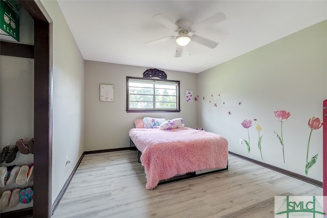 bedroom with wood-type flooring and ceiling fan