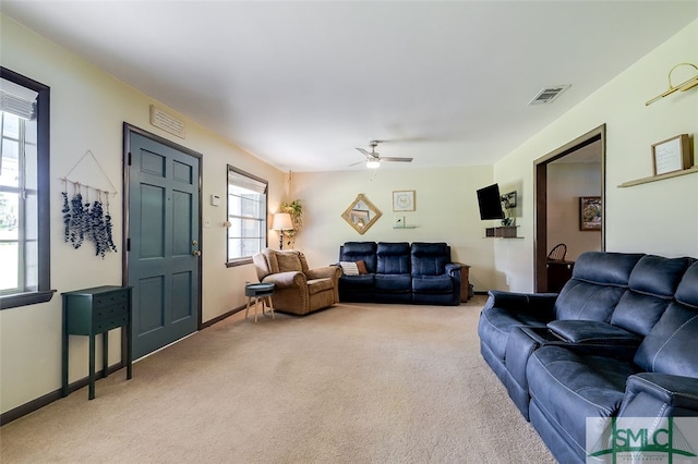 living room featuring ceiling fan and carpet flooring