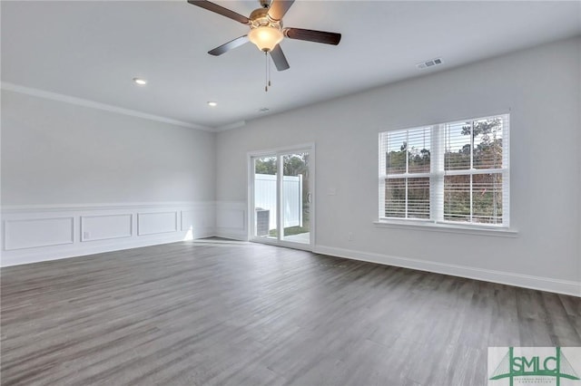 empty room featuring ceiling fan and dark wood-type flooring