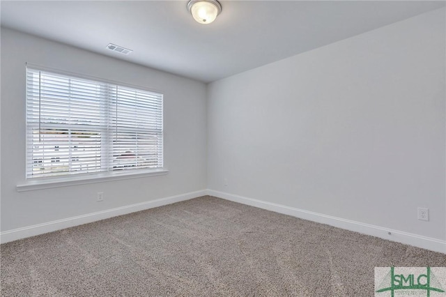 empty room featuring carpet floors