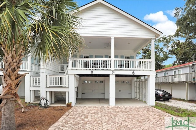 view of front of house featuring a garage and a balcony