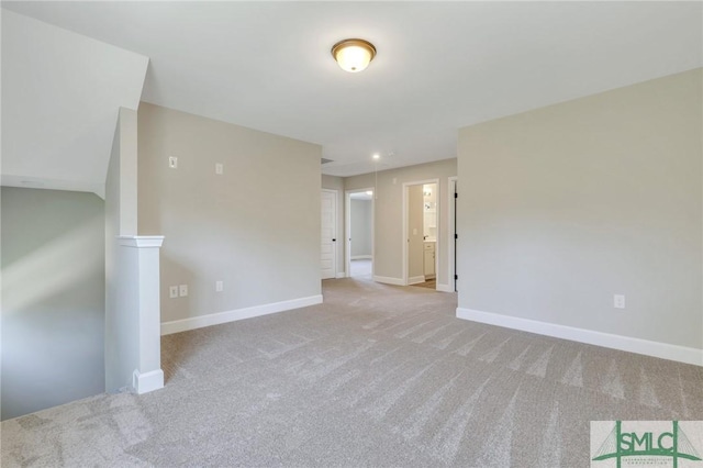 spare room with light colored carpet