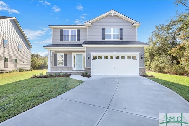 view of front of home featuring a garage and a front lawn