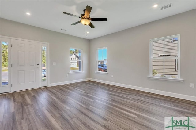 foyer entrance featuring wood-type flooring and ceiling fan