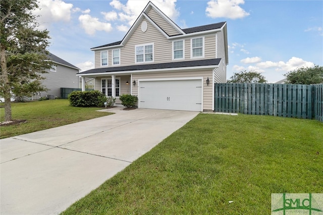 view of front of home with a front yard and a garage