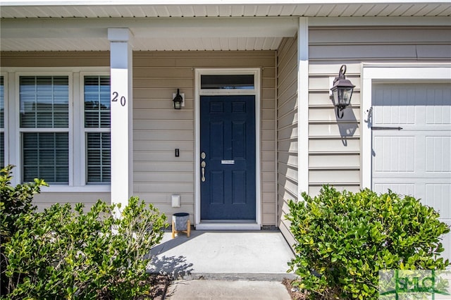 property entrance with a garage