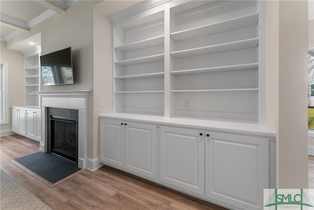 interior space featuring built in shelves and light wood-type flooring